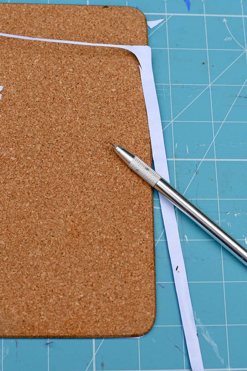 cutting excess paper with craft knife