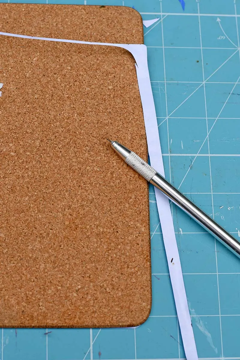 cutting excess paper with craft knife