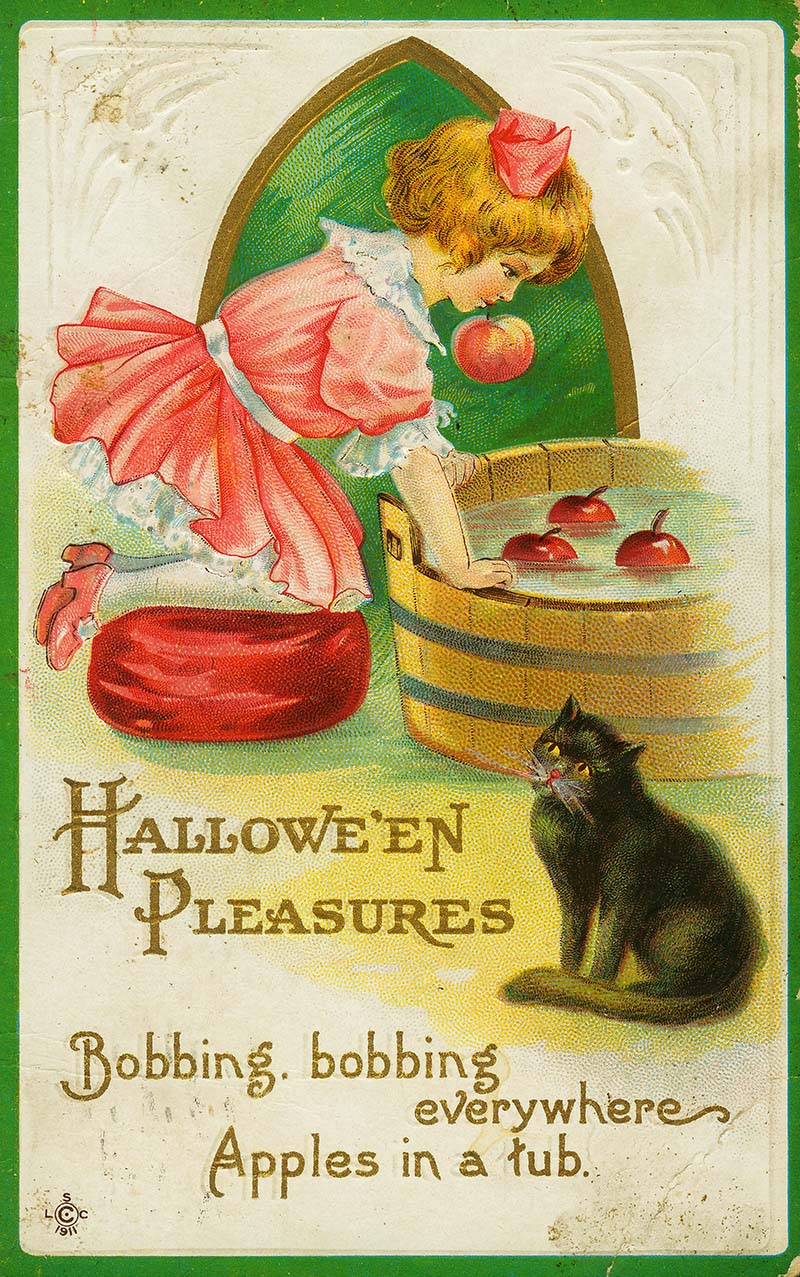 Vintage image of young girl bobbing for apples