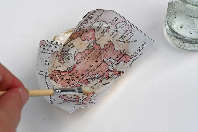 Brushing map with water