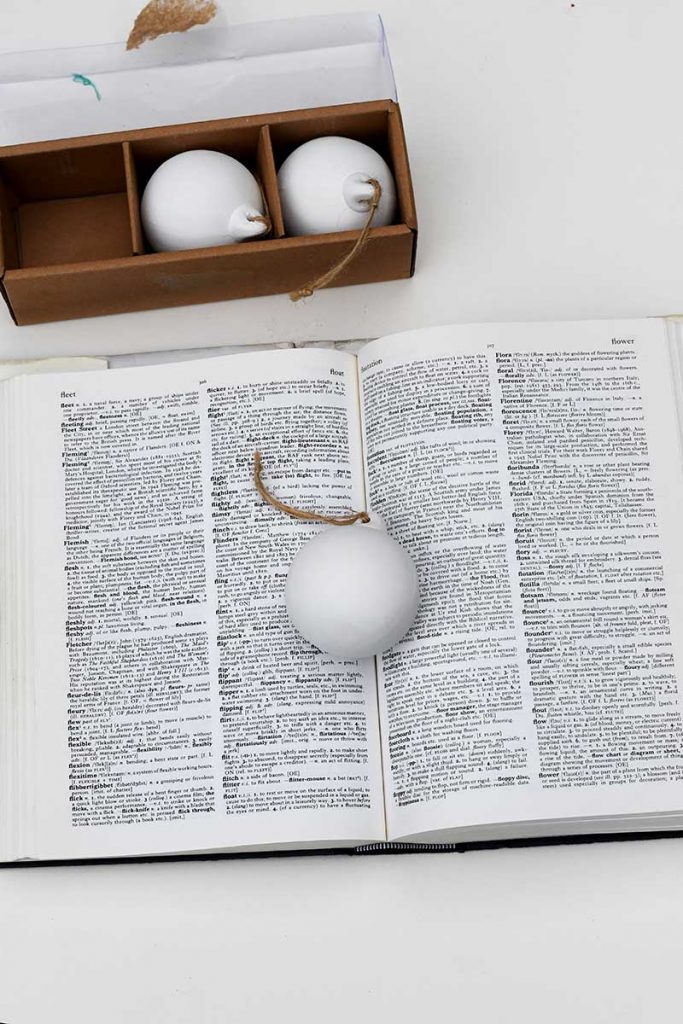dictionary and ceramic baubles