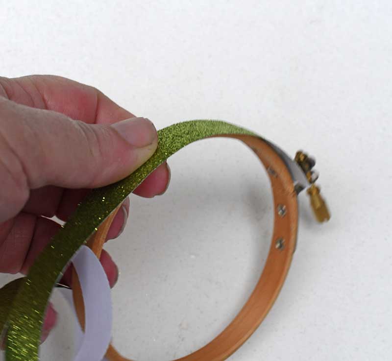 Adding glitter tape to the hoop