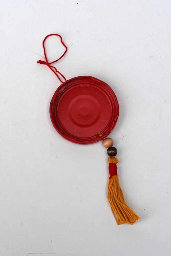 Adding tassel to jar lid