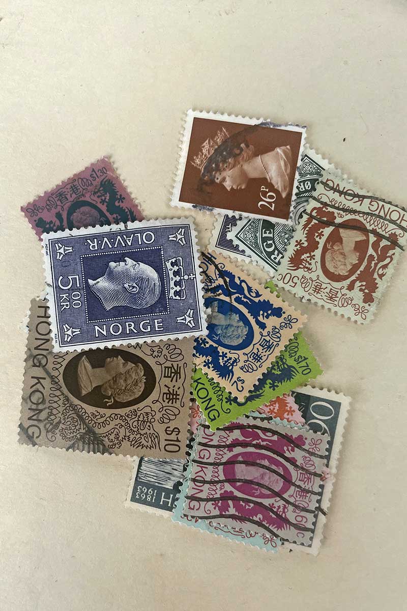 Gathered postage stamps for shadow box