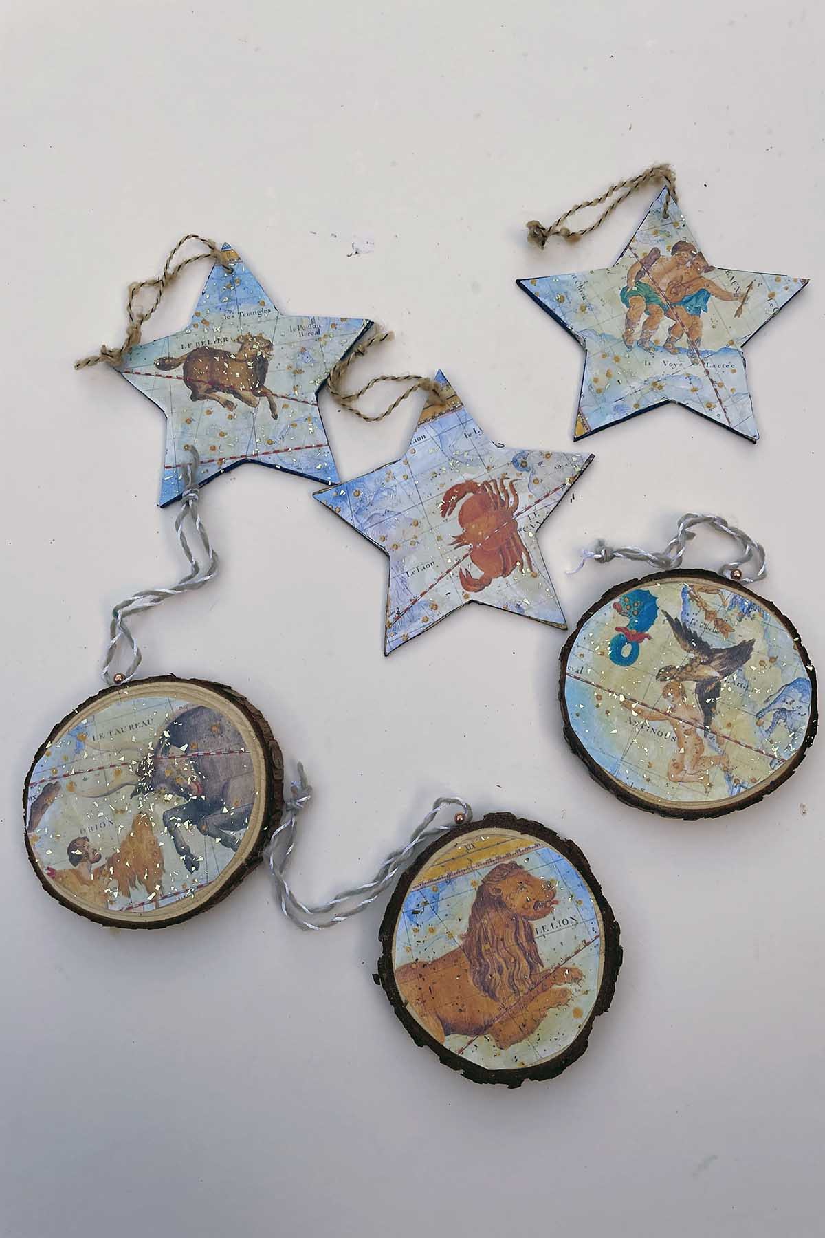 Decoupaged vintage zodiac art wooden Christmas ornaments.
