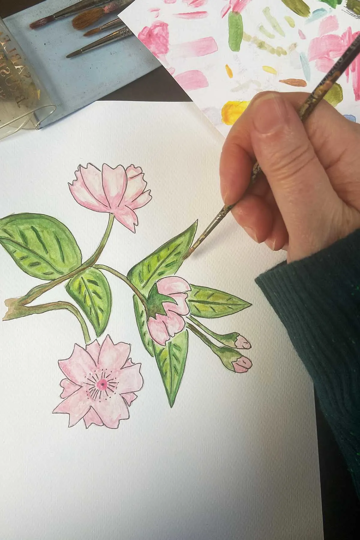 Painting the cherry blossom with watercolour paint