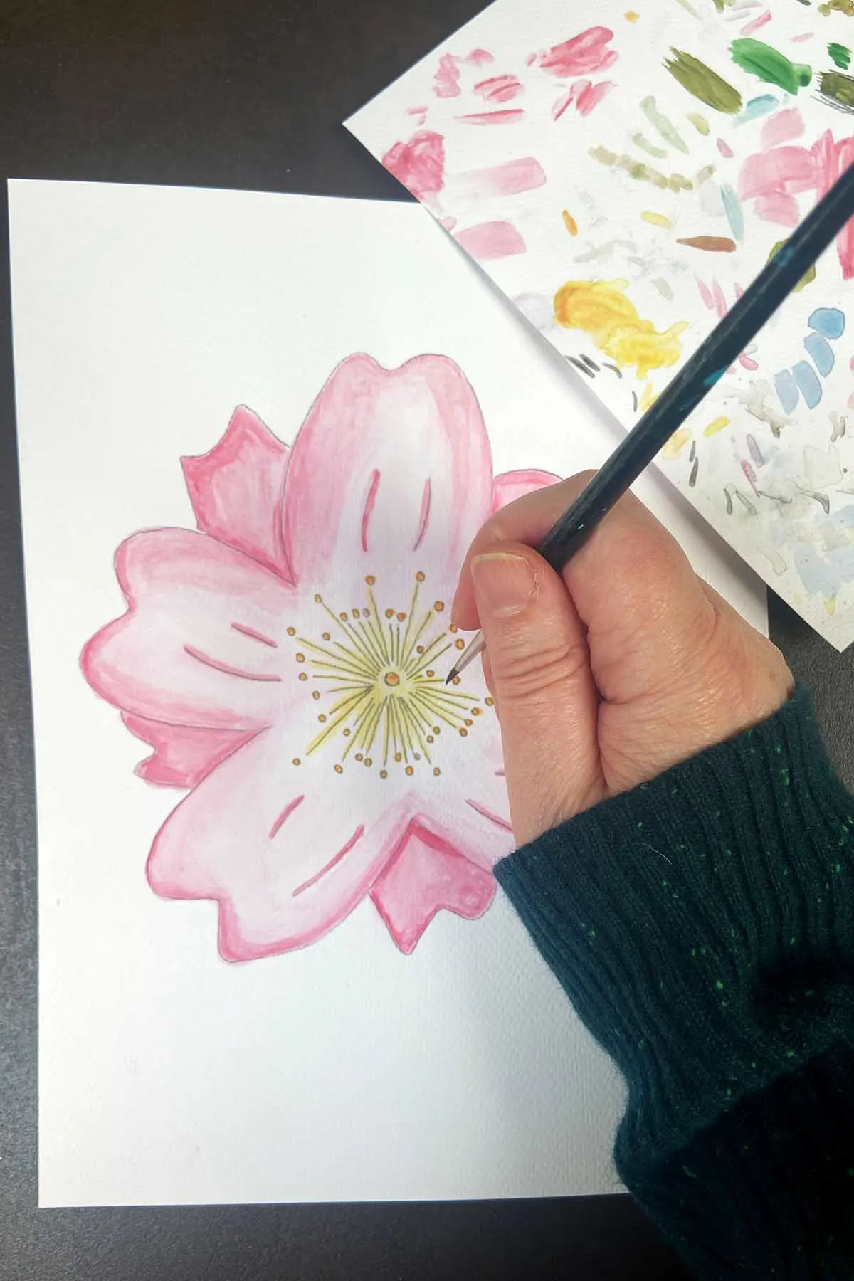 Painting a hand drawn cherry blossom flower