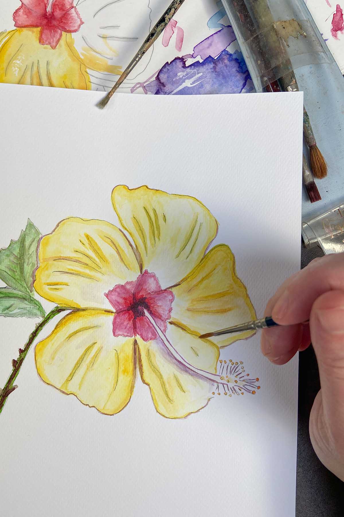 Painting hand drawn hibiscus flower with watercolour paints