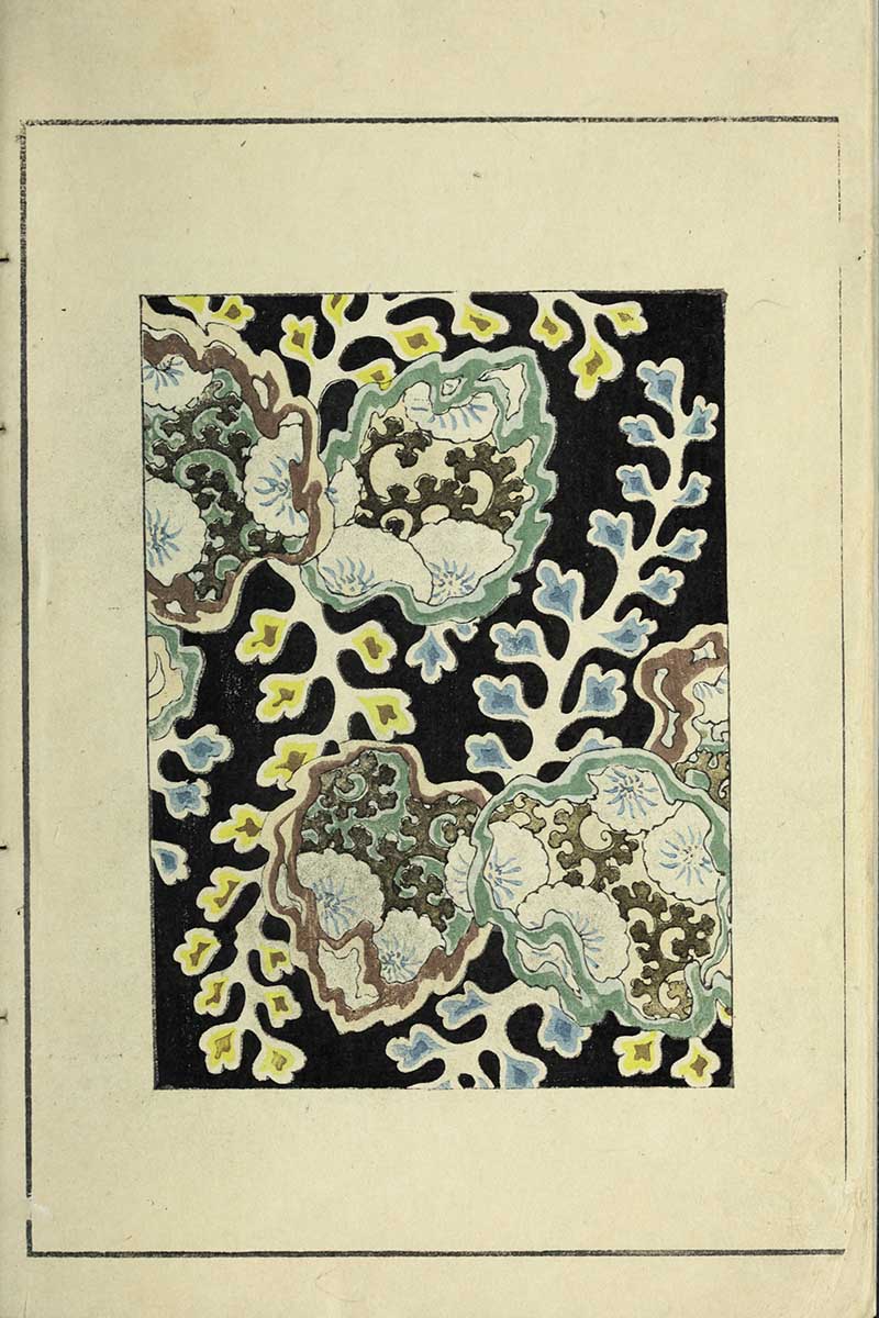 Japanese textile pattern with large stylized peony blossoms and scrolling karakusa arabesque foliage in blue yellow and brown on black background vintage Nippon collection