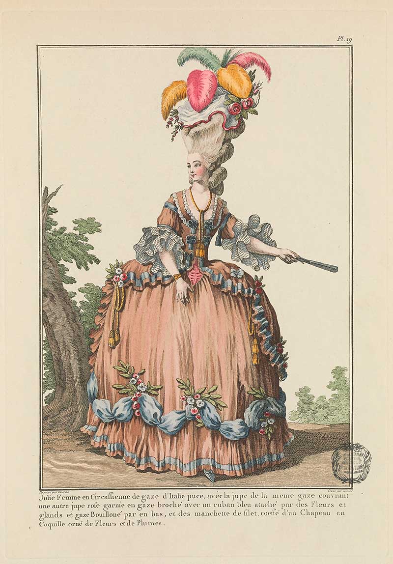 Woman in a peach and blue floral-trimmed gown with large feathered headdress and fan, seated near a tree, French Galerie des Modes fashion print 18th century costume illustration