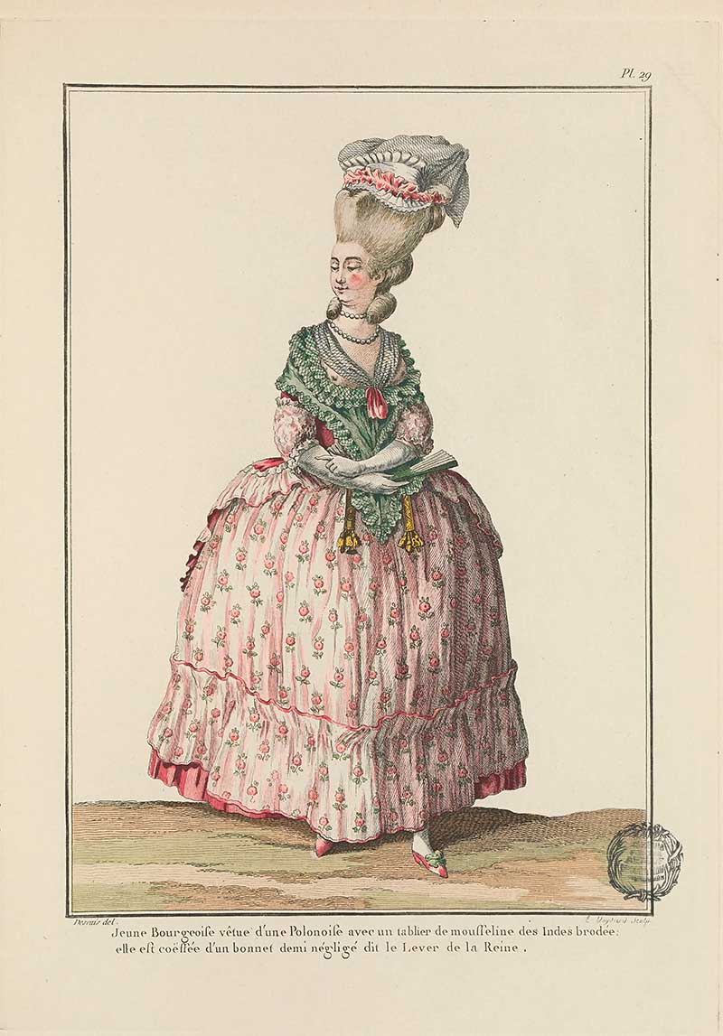 Woman in a pale floral gown with green shawl and high ribboned cap standing in profile, French Galerie des Modes fashion print 18th century costume illustration