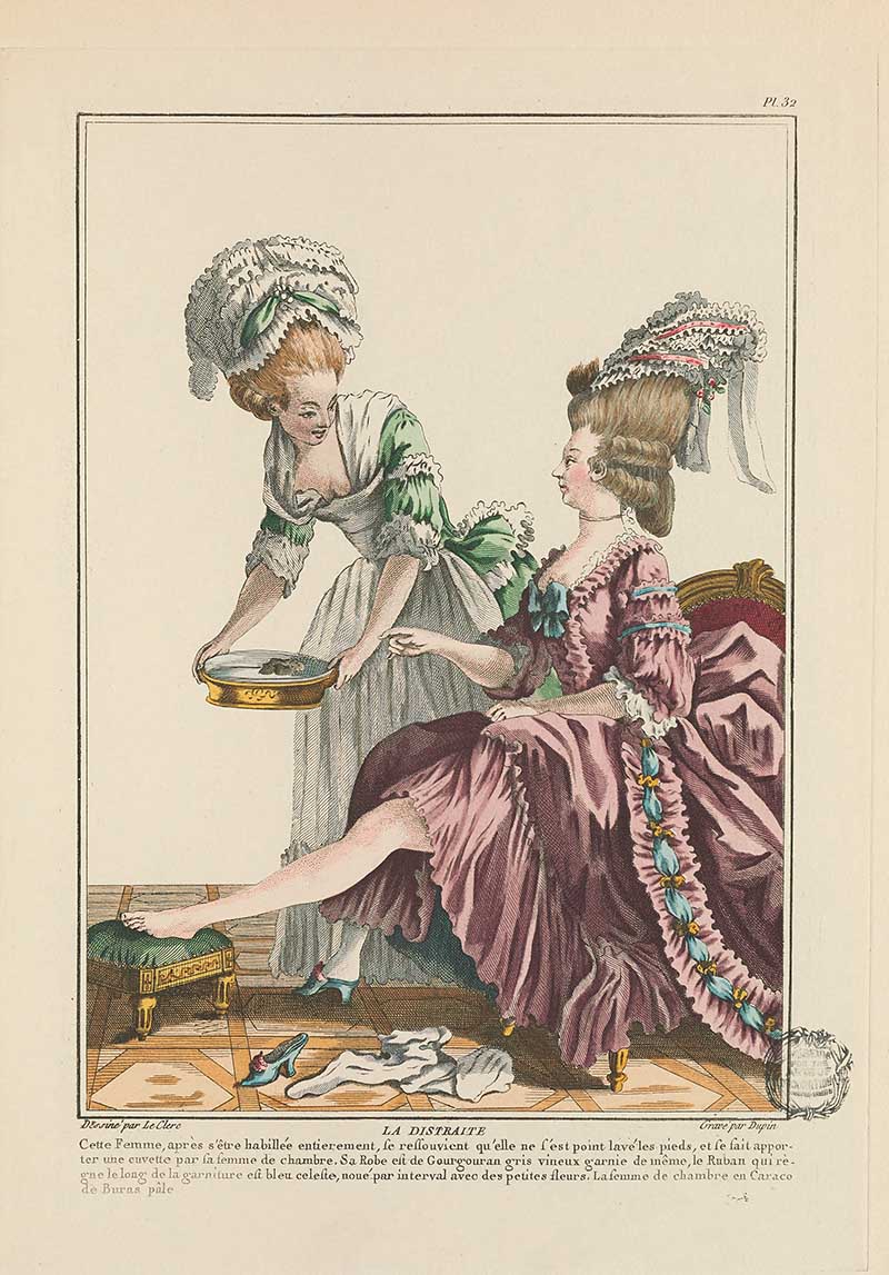 Lady seated in a rose gown while a maid washes her foot in a basin, with shoes on the floor nearby, French Galerie des Modes fashion print 18th century costume illustration