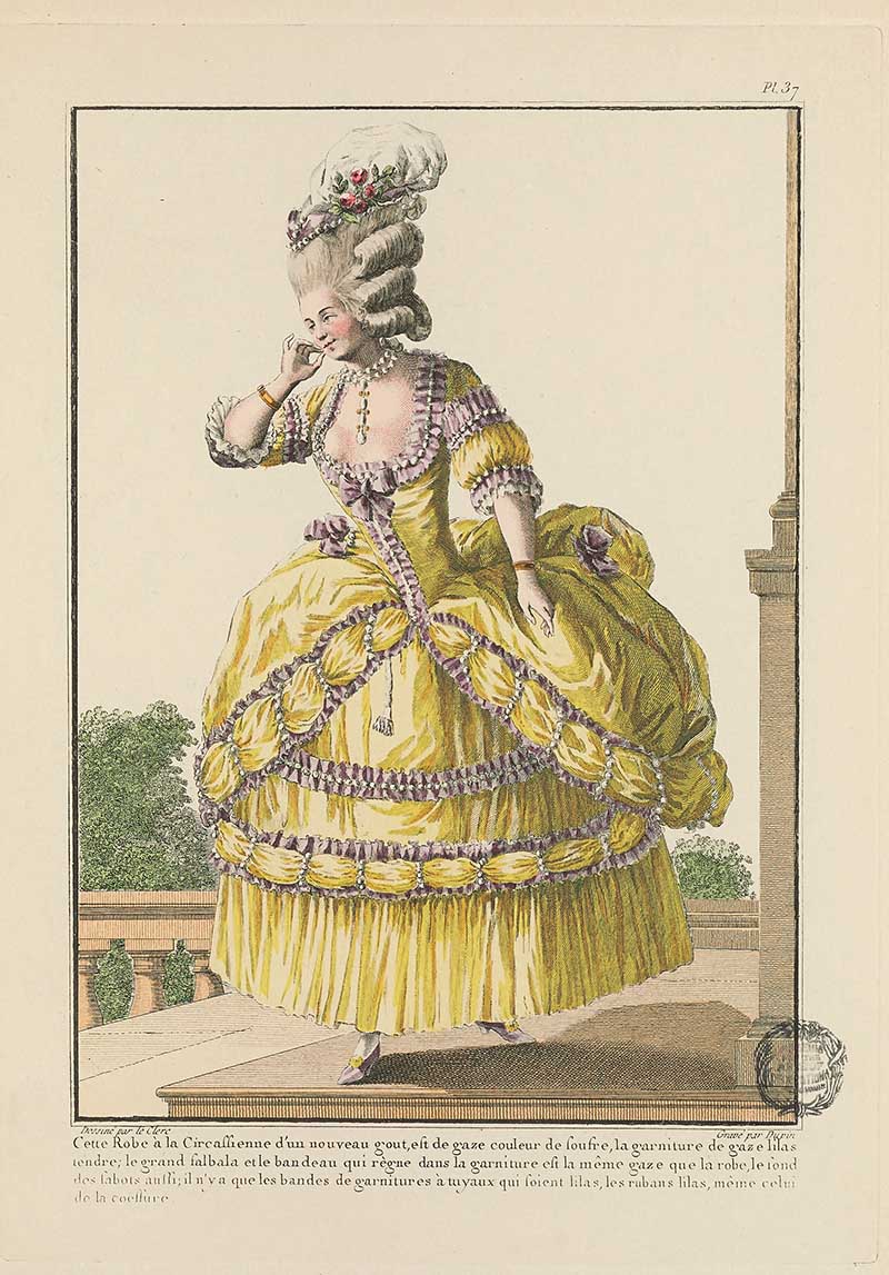 Woman in an elaborate yellow gown with purple trim and high floral hairstyle standing on a terrace, French Galerie des Modes fashion print 18th century costume illustration