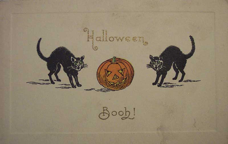 Halloween “Booh!” card with two black cats and a jack-o’-lantern.