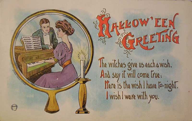 Halloween Greeting postcard with a couple at a piano reflected in a mirror and a verse wishing the recipient near.