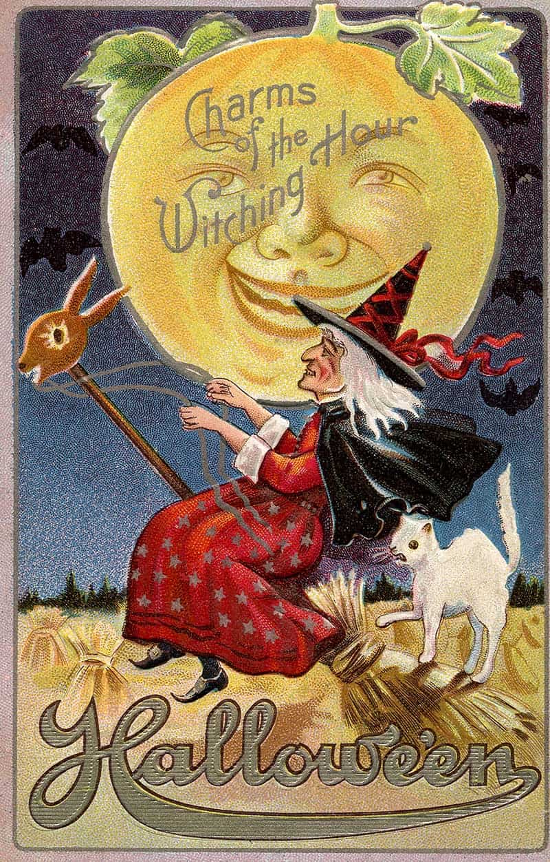 Witching Hour Halloween postcard with a witch on a broom, moon face, bats, owl and white cat.