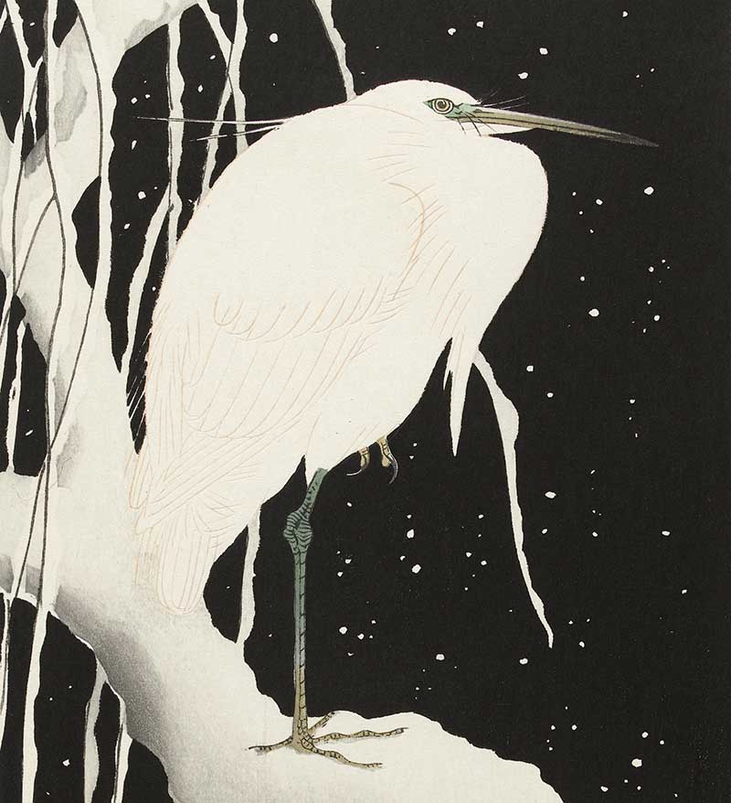 White egret perched on a snow-covered tree trunk against a dark wintry sky, Japanese woodblock print by Ohara Koson.